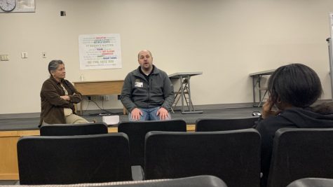 Farm Bureau insurance agent and Ellis County Emergency Medical Technician speaks to students during PRIDE Time