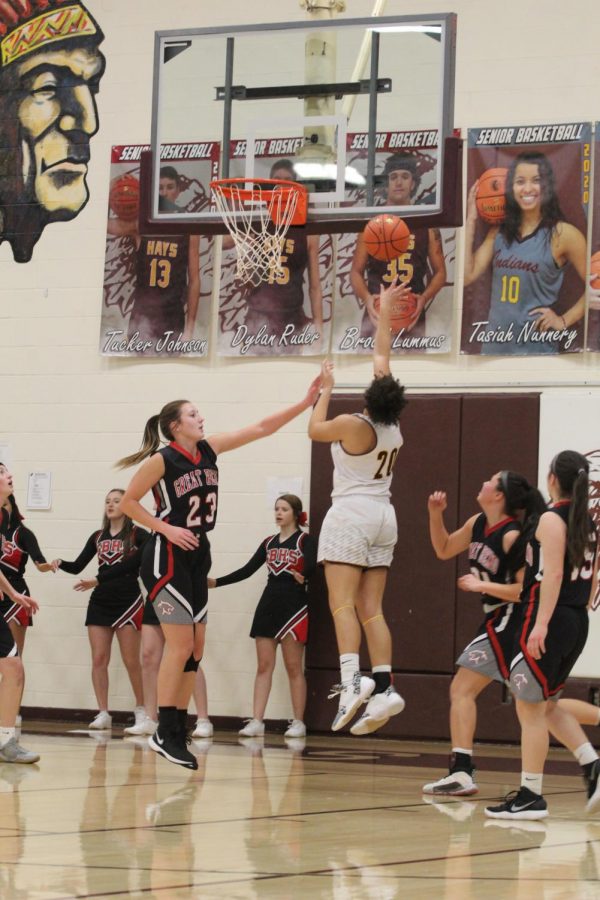 Junior Re Green goes up for a shot in during the game against Great Bend on Jan. 14. 