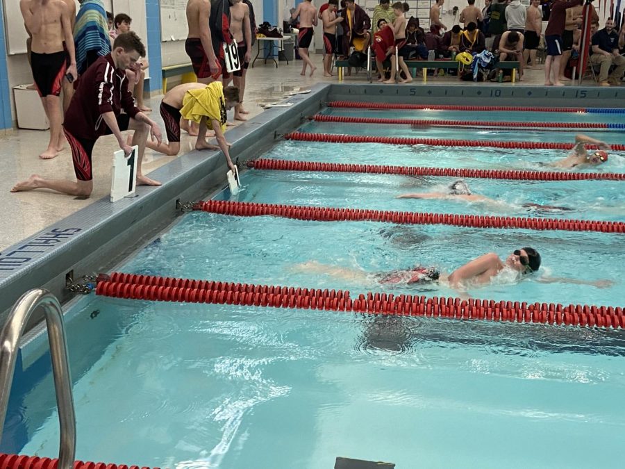 Freshman Jude Tippy on his first lap in the 500 freestyle event.