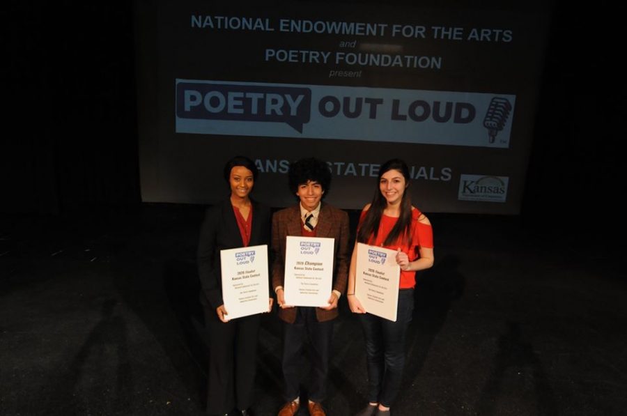 Senior Mulu Bannister stands with the first place winner and second runner-up of the State Poetry Out Loud competition.