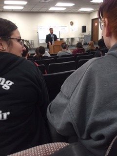 Officer Burkholder answers questions from freshman Gilda Allen.