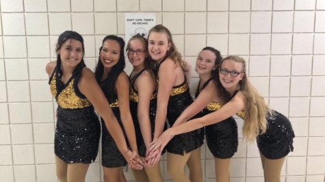 The Dance Team girls pose for a picture as they wait for their team pictures to be taken.
