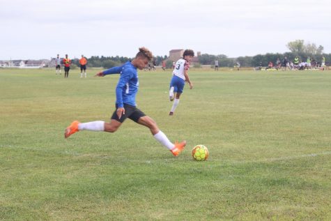 Sophomore Diego Muller takes a corner kick in hopes to give his teammates a chance score.