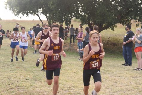 Freshmen Logan Chance and Everett McClure compete in the Boys JV race.