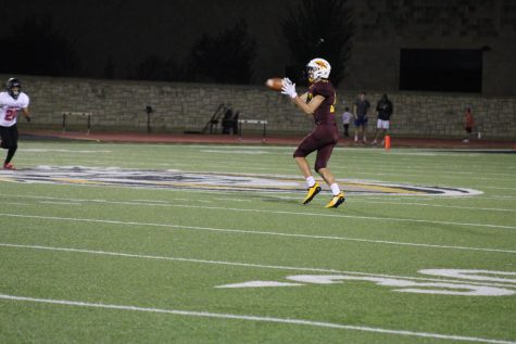 Senior Dalyn Schwarz makes a wide open catch in the game vs. Liberal.