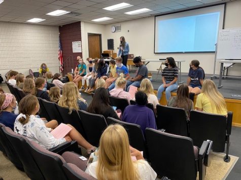 Student Council president Alicia Feyerherm presents homecoming plans for this school year.
