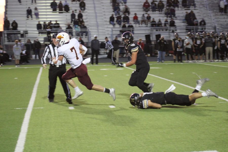 Junior wide receiver/ quarterback Jaren Kanak out runs opponents to find the endzone on October 16th at Maize South. 