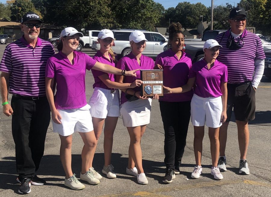The HHS varsity girls golf team poses for a picture with their new trophy. From left to right, Assistant coach Doug Lowen, senior Sophie Garrison, sophomore Katie Dinkel, senior Sierra Smith, junior Taleia McCrae, freshman Abbie Norris and coach Mark Watts.