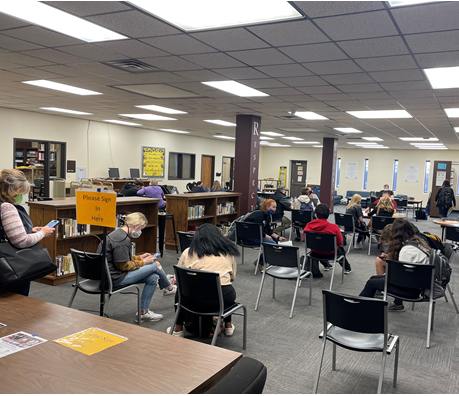 Students and parents enroll for spring concurrent credit on Jan. 13 in the Hays High library.
