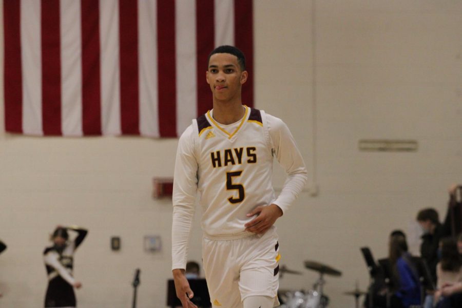 Senior point guard Tj Nunnery brings the basketball up the court vs the Garden City Buffaloes on January 15th. 