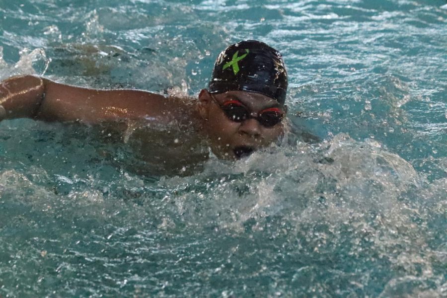 Junior Alex Johnson swims at the center for Health Improvement in Hays on Jan. 19, 2021.