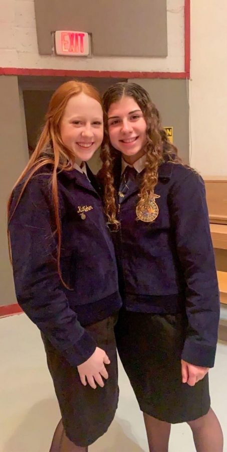 Sophomores+Amelia+Jeager+and+Karli+Neher+pictured+at+an+FFA+event+in+their+official+dress.+