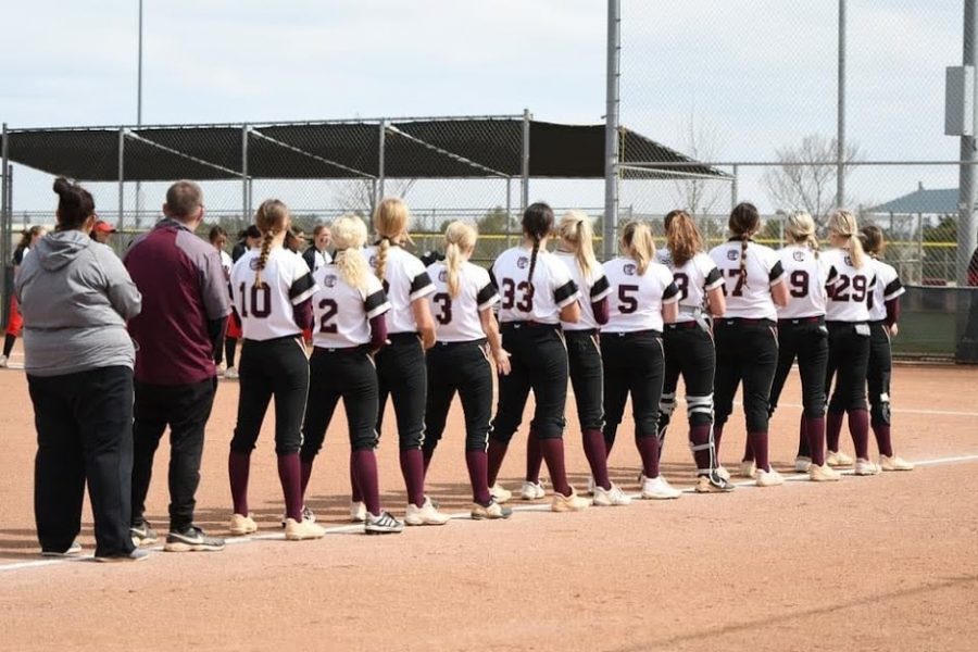 The Lady Indians stand for the national anthem before their final game of the week against Liberal. They would go on to win with a walk off in the bottom of the eighth inning. 