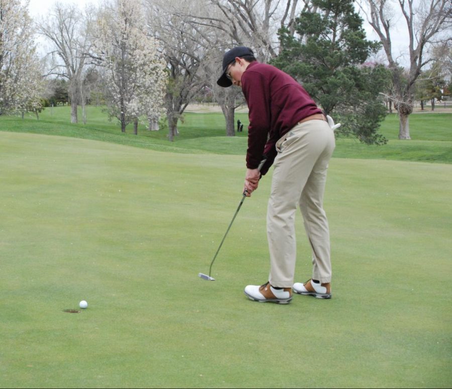 Senior Jason Krannawitter two-putts on the back nine at the Hays Invitational Tournament at Smoky Hill Country Club