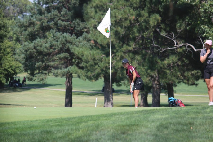 Junior Claire Humphrey watched her putt at the Hays High Invitational Tournament at Smoky Hill Country Club.