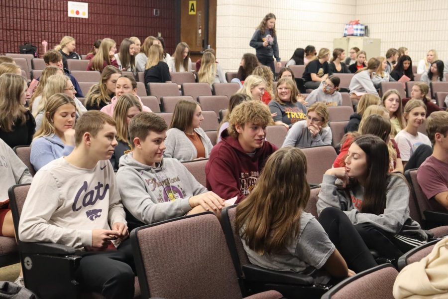 Students attend a Student Council meeting in the Lecture Hall.