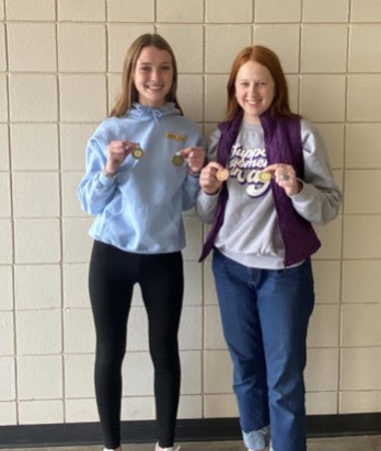 Seniors Jalynn Weilert and Karli Neher display their medals, as they were two of the members on the FFA senior ritual team who earned “Master.” A Master award in an FFA competition is the highest award one can earn; it means the competitor was the best out of all the teams in the contest. Hays High School FFA also had a greenhand team that placed first in par law and second in ritual. Both the greenhand and senior team will go to state over the summer from May 31 to June 4.  