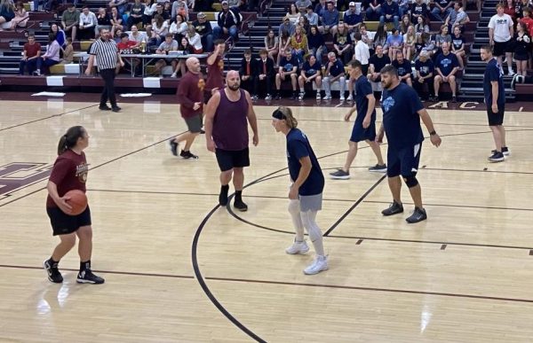 The Hays High staff plays against TMP staff in a basketball game