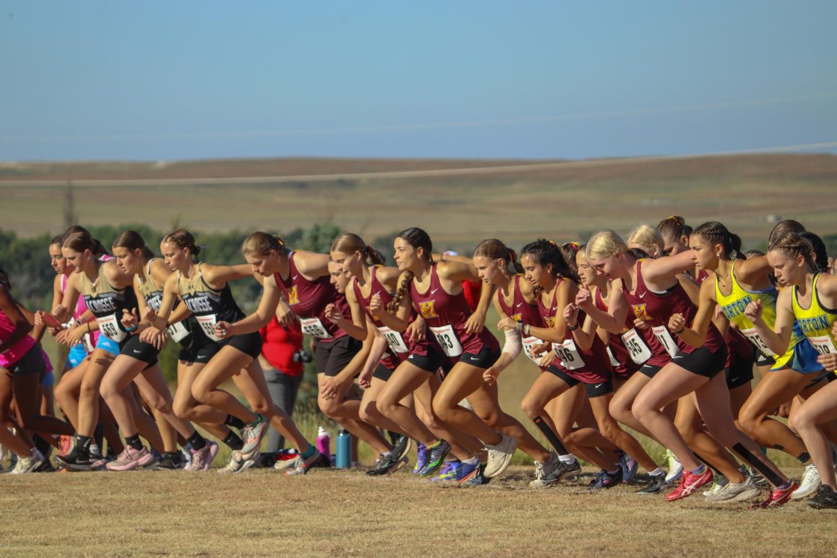 The Indian girls cross country team bolts off of the starting line at their home meet on Sep. 19. 