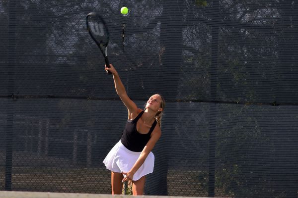 Alyse Zimmerman hitting the ball at the Hays High Tennis meet. 