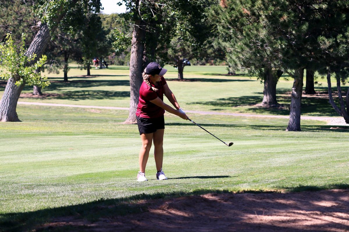 Senior Jaycee Oakley takes a swing at the Sept. 3 varsity golf tournament in Hays.