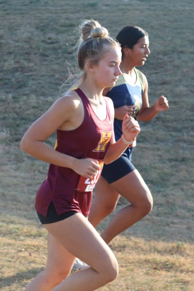 Junior Cara Cunningham runs past an opponent at the Oct. 12 race in Salina.