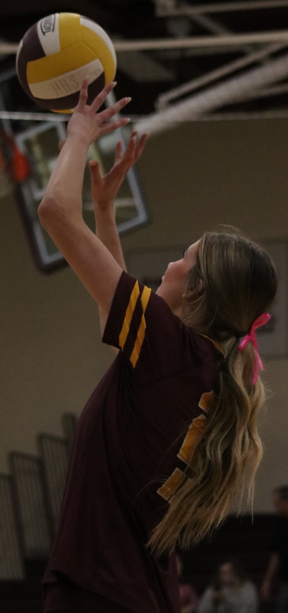 At the Philipsburg vs Hays Game, Sophomore Brooke Beiker serves the ball over the net.