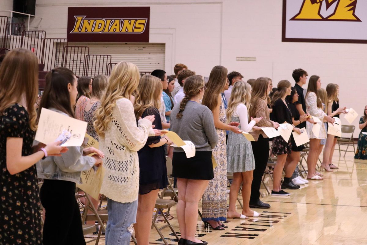 New NHS inductees repeat the pledge after they have been inducted on November 12.