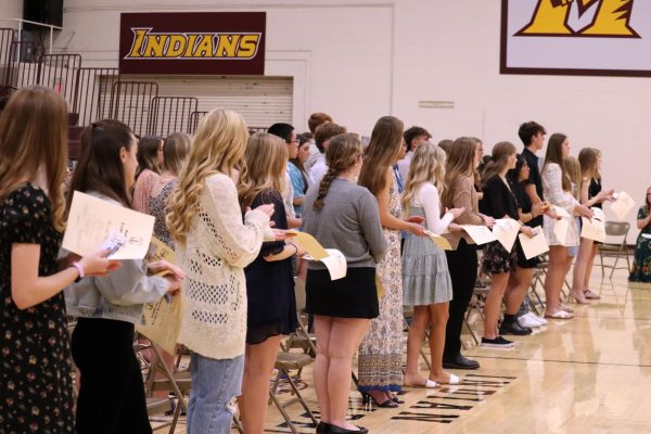 New NHS inductees repeat the pledge after they have been inducted on November 12.