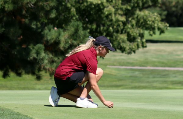 Junior Lily Butler prepares for her turn at a golf tournament earlier this year.