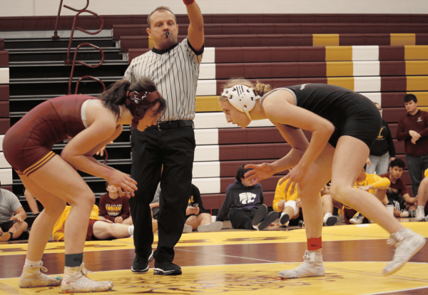 Reese Vehige prepares to wrestle against her opponent Hays Vs. Salina Invitational on Dec. 12. 