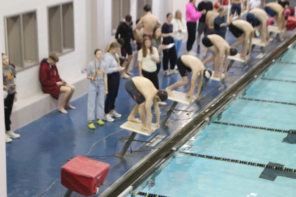 Swimmers prepare to start their race at the meet in Hays on January 21. 