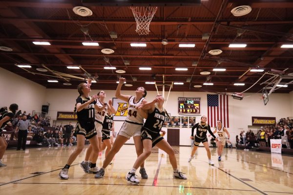 Junior Zoe Winter fights for a rebound against the Lady Newton basketball team on December 6 at the Hays City Shootout.