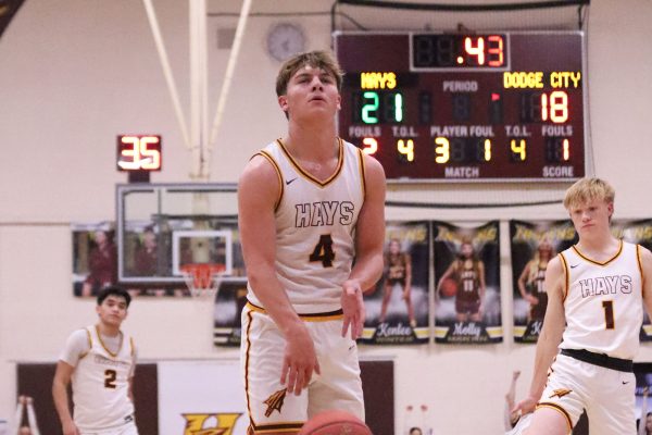 Cooper Lindenmeyer gets set to attempt a free throw against Dodge City.