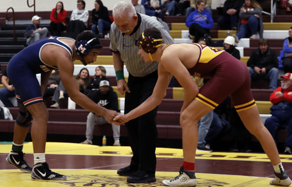 Senior Dalton Meyers handshakes his opponent on Jan. 24 at the Bob Kuhn Invitational. 