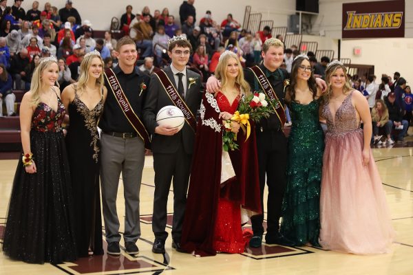 Indian Call candidates pose for a photo after the crowning between the boys and girls basketball games.