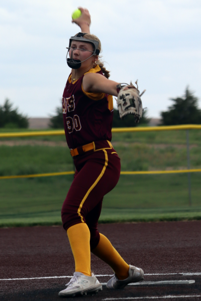 Senior Riley Dreher prepares to pitch the ball to the opposing team at the Hays High vs Liberal home game.
