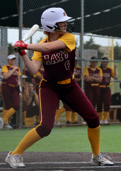 Sophomore Shea Augustine prepares to swing her bat at the Liberal Vs. Hays game on May 6.