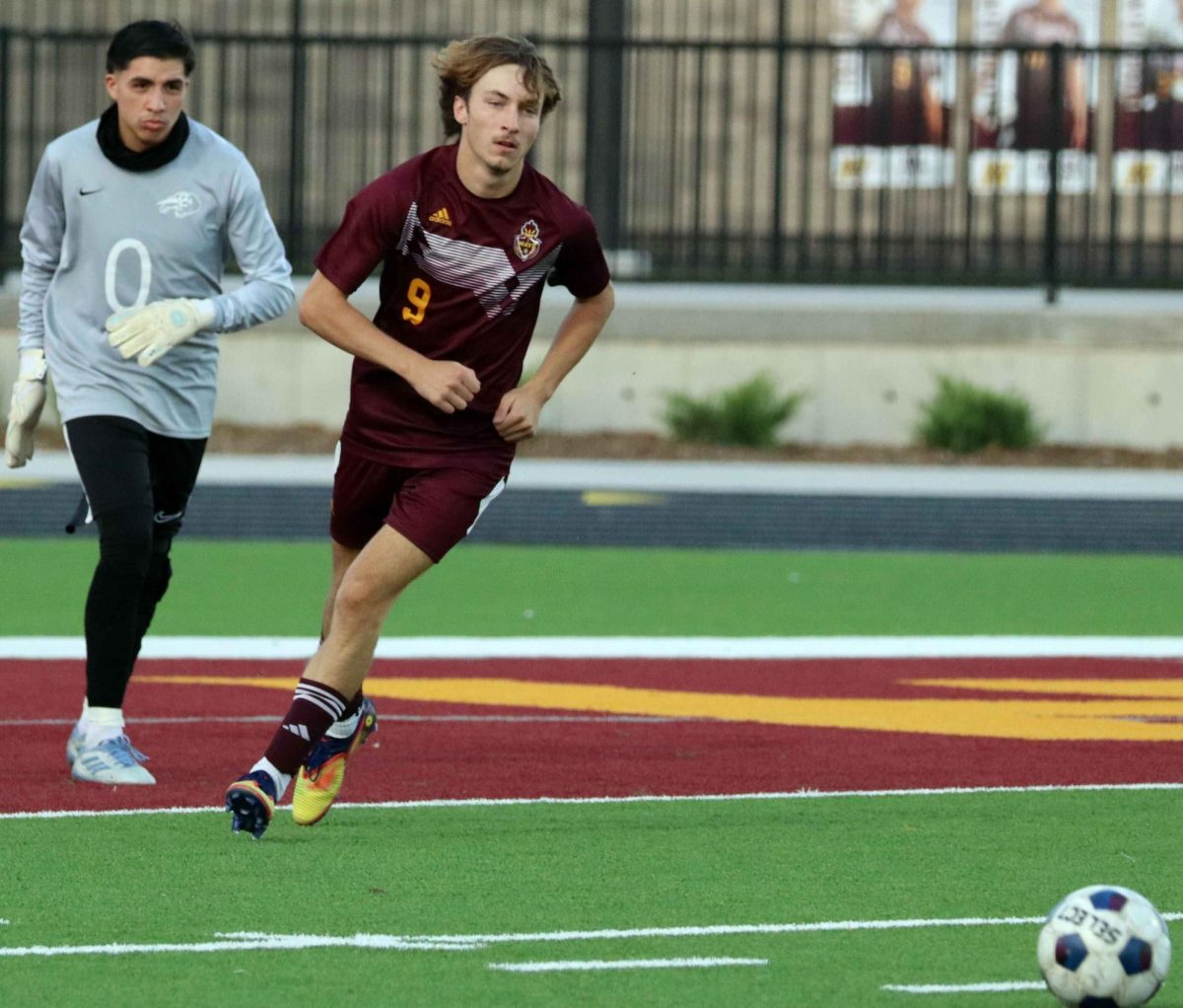 As the soccer match commences, senior Kal Longsdale prepares to kick the ball to the other side of the field at the Hays vs. Garden City game on Oct. 17.