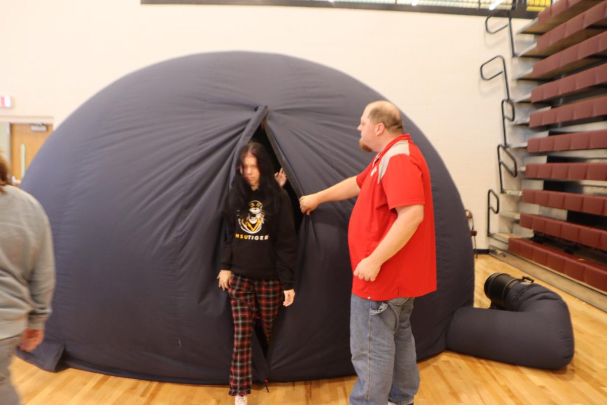 Mr. Decker and students exit the planetarium.